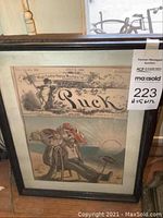 Framed Puck political illustration showing man reclining on beach beneath magazine title