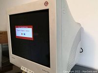 Side angled view of Samsung CRT monitor showing screen with 'No Connection' message, body vents and front controls