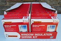 Full case showing 18 packages of Frost King Window Insulation Shrink Kits arranged in two rows inside a branded box.