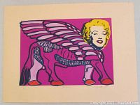 Full view of the signed and numbered print showing the winged Lamassu figure with Marilyn Monroe's face in vibrant colors on an off-white border.