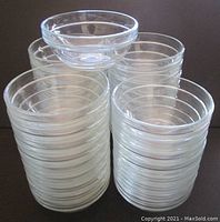 Stack of clear Arcoroc glass prep bowls showing their cylindrical shape and transparency.