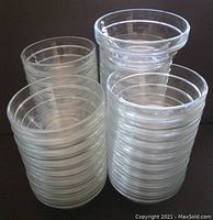 Stacked group of clear glass bowls showing quantity and uniform design with visible rim edges for each bowl