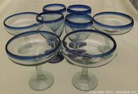 Eight vintage blue accented stemware glasses: 4 wine glasses and 4 margarita glasses arranged together to show set contents.