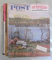 View of front covers and edges of 13 Saturday Evening Post magazines, showing condition and variation in issue dates.