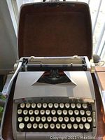 Full view of the Sears Citation 88 manual typewriter in its open hard case, showing the keyboard area.