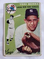 Front of 1954 Topps Yogi Berra baseball card showing full-color photo of the player with Yankees logo and name