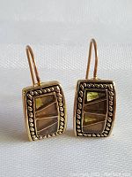 Front and angled view of the pair of rectangular Monet Studio costume earrings showing their design and condition.