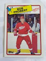 Front image of 1988-89 Topps rookie card featuring Bob Probert in Detroit Red Wings uniform on ice.