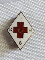 Diamond-shaped antique hospital service pin with white enamel background, red enamel cross, and 'KGH' lettering with the number '6'.