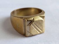 Front three-quarter view showing square top with raised diagonal geometric pattern