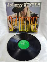 Front view of Johnny Winter 3rd Degree vinyl record with album cover and record shown.