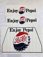 Three vintage Pepsi decals featuring the old Pepsi-Cola bottle cap logo and 'Enjoy Pepsi' text, displayed flat.