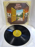 Bruce Cockburn vinyl record laid in front of album cover showing the label and part of the vinyl surface.