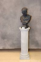 Front view of the Roman style bust mounted on the faux marble pedestal showing the height and proportions.