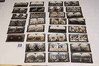 Overhead view of all 30 stereoview cards arranged in six columns on white background