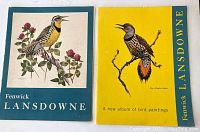 Two vintage Fenwick Lansdowne bird art print albums, one teal with a bird on red clover, and one yellow with a red-shafted flicker bird.