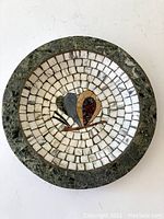 Full top-down view of the vintage round mosaic dish showing the central abstract design and outer green stone rim.