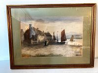 Full view of framed watercolour painting showing fishing village scene with boats, houses, and figures on dock.