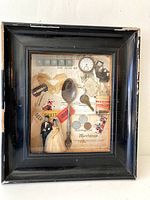 Frontal view of shadow box art showing rusty spoon, miniature bride and groom, cards, clock face, bottle, coins, and paper background.