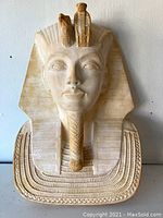 Front view of vintage plaster Egyptian Pharaoh bust with detailed headdress and facial features.