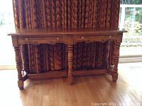 Full view of vintage Peppler oak sofa table showing spindle legs, scalloped apron, and warm oak finish.