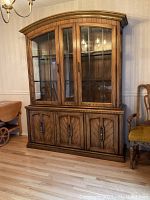 Full view of closed china cabinet showing four lower doors, two drawers, and glass doors on top