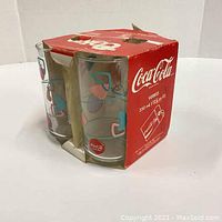 Four Coca Cola Libbey glasses in original red branded box with atomic design