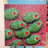 Front view of the large square painting showing green olives with red centers on a maroon background, signed in lower right corner