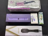 Lot contents including boxed Bestope professional hair straightener, Bestope three-rod curlers, AEVO hot air brush, Dawn nail dryer, and face hair remover/eyebrow trimmer.
