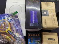 Overview of all 5 items showing packaging and product types including mosquito killer box, bug zapper rackets, and light trap boxes.