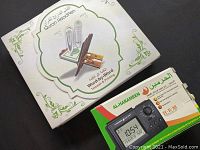 Quran ReadPen product packaging box showing images of digital pen and Quran book, Arabic text, and branding.