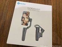 Closed retail box of FeiyuTech VLOG pocket Foldable Smartphone Gimbal showing the product and folded size images.