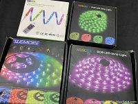 Boxed RGB LED strip lights from brands KOVEL, MINGER, and SUEMORE, showing the packaging and color variety of the light strips.