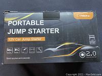 Closed retail box of Yaber Portable Jump Starter showing 12V car jump starter label and features.