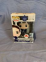 Front view of the Austin Matthews Pop figure in original box showing figure, logos, and character name.