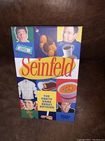 Front of the sealed Seinfeld game box showing title and character images