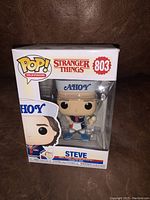 Front view of Funko Pop box showing Steve in AH0Y sailor outfit, clearly displaying the Stranger Things logo and item number 803.