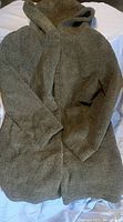 New women's size XL jacket in dark gray faux shearling, hooded with button front.