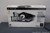 Full front view of DJ Hero 2 controller retail box, showing product image and branding.