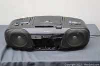 Front view of Sony boombox showing missing cassette door and dual speakers
