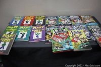 All books in the lot arranged on a table, showing mix of Captain Underpants, Diary of a Minecraft Zombie, and Minecraft Zombie books