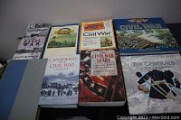 Full lot of eight Civil War related books laid out on a surface, showing their front covers.