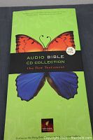 Front cover of the Audio Bible CD Collection case showing a butterfly with orange and blue wings and text indicating 15 CDs of the New Testament.