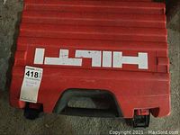 Closed red plastic case with Hilti logo and MaxSold lot sticker