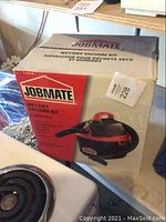 Original packaging box for Jobmate wet dry vacuum kit showing product image and brand label.