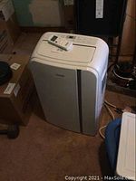 Front-angle view of portable air conditioner showing overall condition and design.