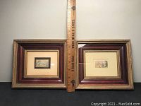 Two small framed matchbox-style paintings side by side, each with mats and wood frames, featuring landscapes.