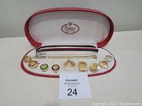 Wide view of entire Clebar watch set including bands and face accents neatly arranged inside original red and white Clebar case.