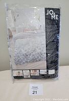 Packaged new Jo & Me duvet cover set in original plastic wrapping showing cover design and brand label.