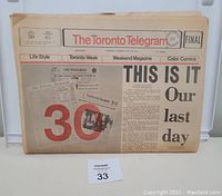 Front page of the last Toronto Telegram newspaper issue with large headline indicating final edition.